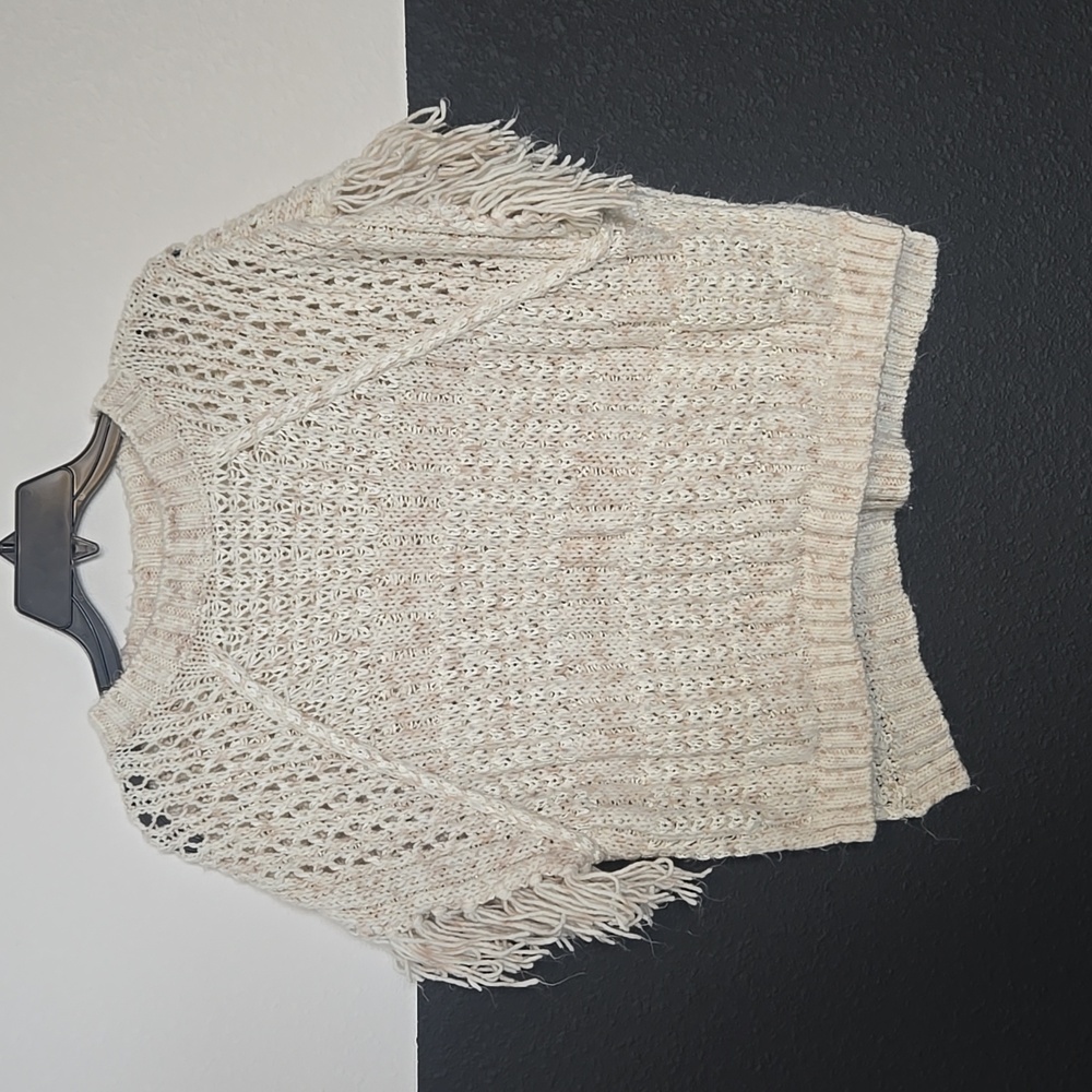 Knitted, tassled, poncho-style sweater